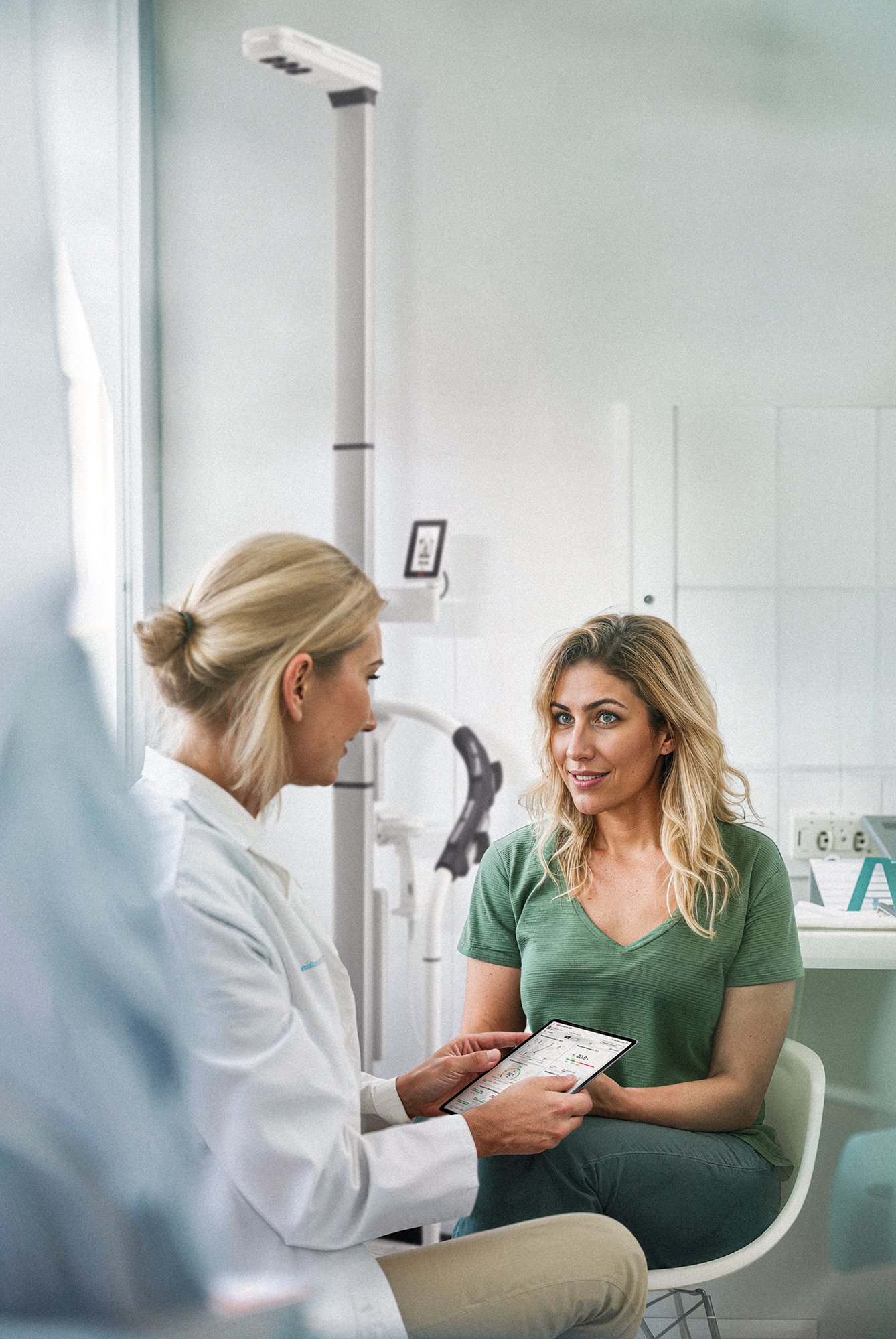 female-doctor-showing-a-patient-on-ipad female-doctor-showing-a-patient-on-ipad